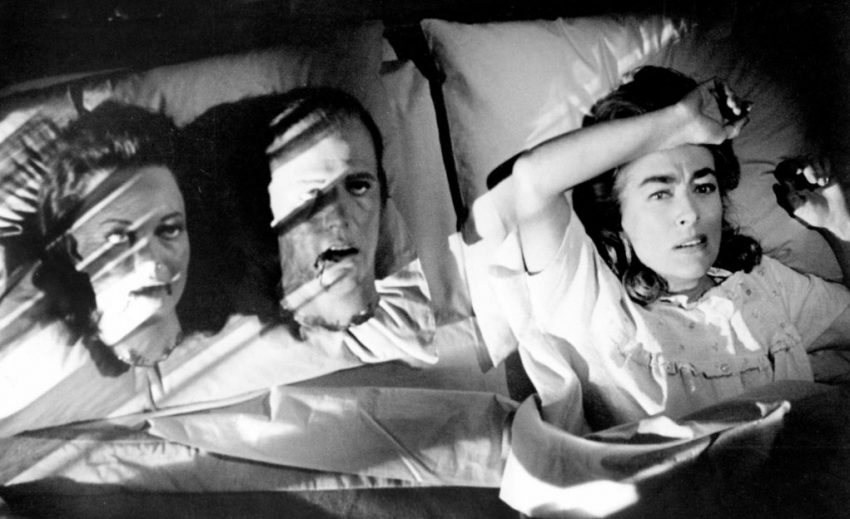 Lucy Harbin (Joan Crawford) waking up with models of severed heads in her bed.